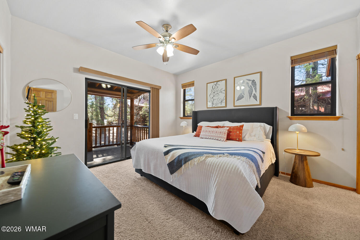 1041 South Pinon Circle Show Low, AZ 85901 - Photo 15 of 29 a bedroom with a large bed and a chandelier