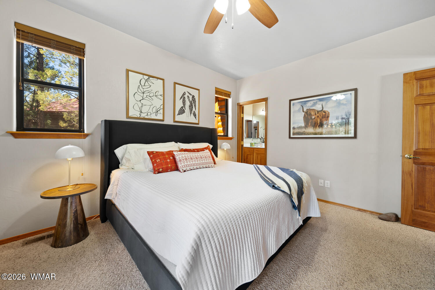 1041 South Pinon Circle Show Low, AZ 85901 - Photo 16 of 29 a bedroom with a bed and painting on the wall