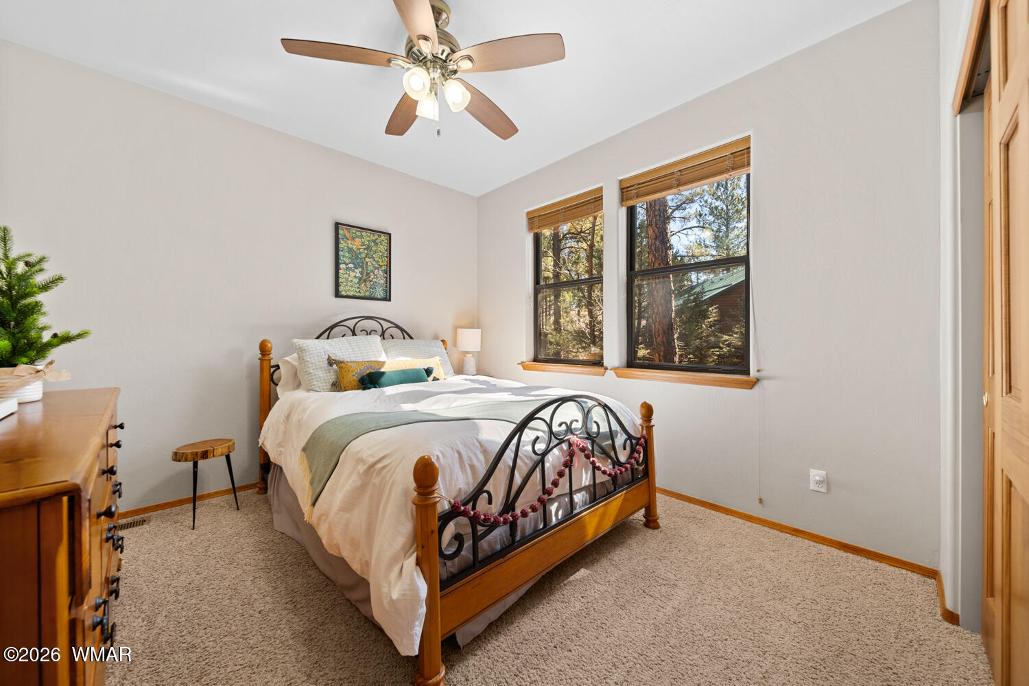 1041 South Pinon Circle Show Low, AZ 85901 - Photo 20 of 29 a bedroom with a bed and a window