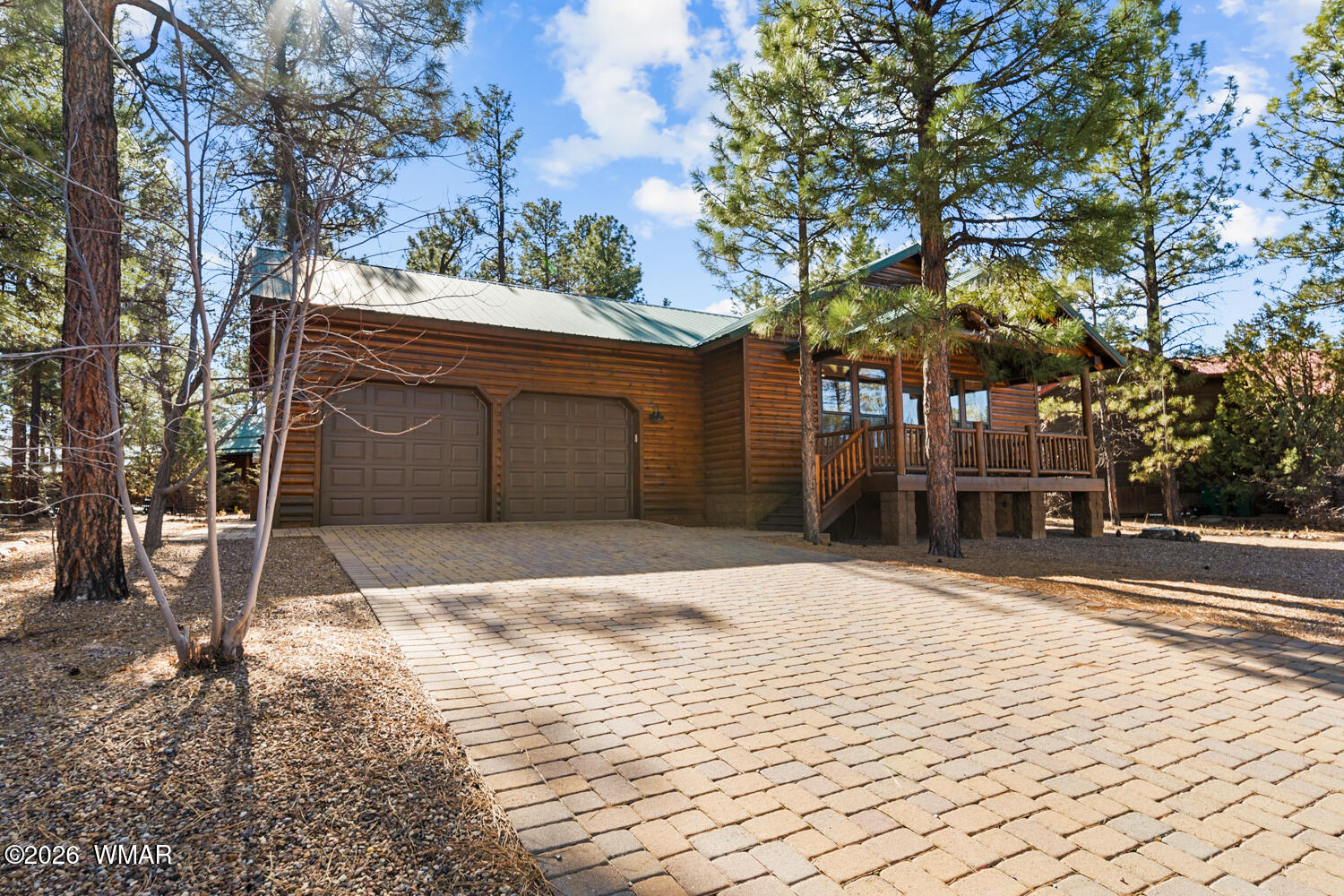 1041 South Pinon Circle Show Low, AZ 85901 - Photo 2 of 29 a house with trees in front of it