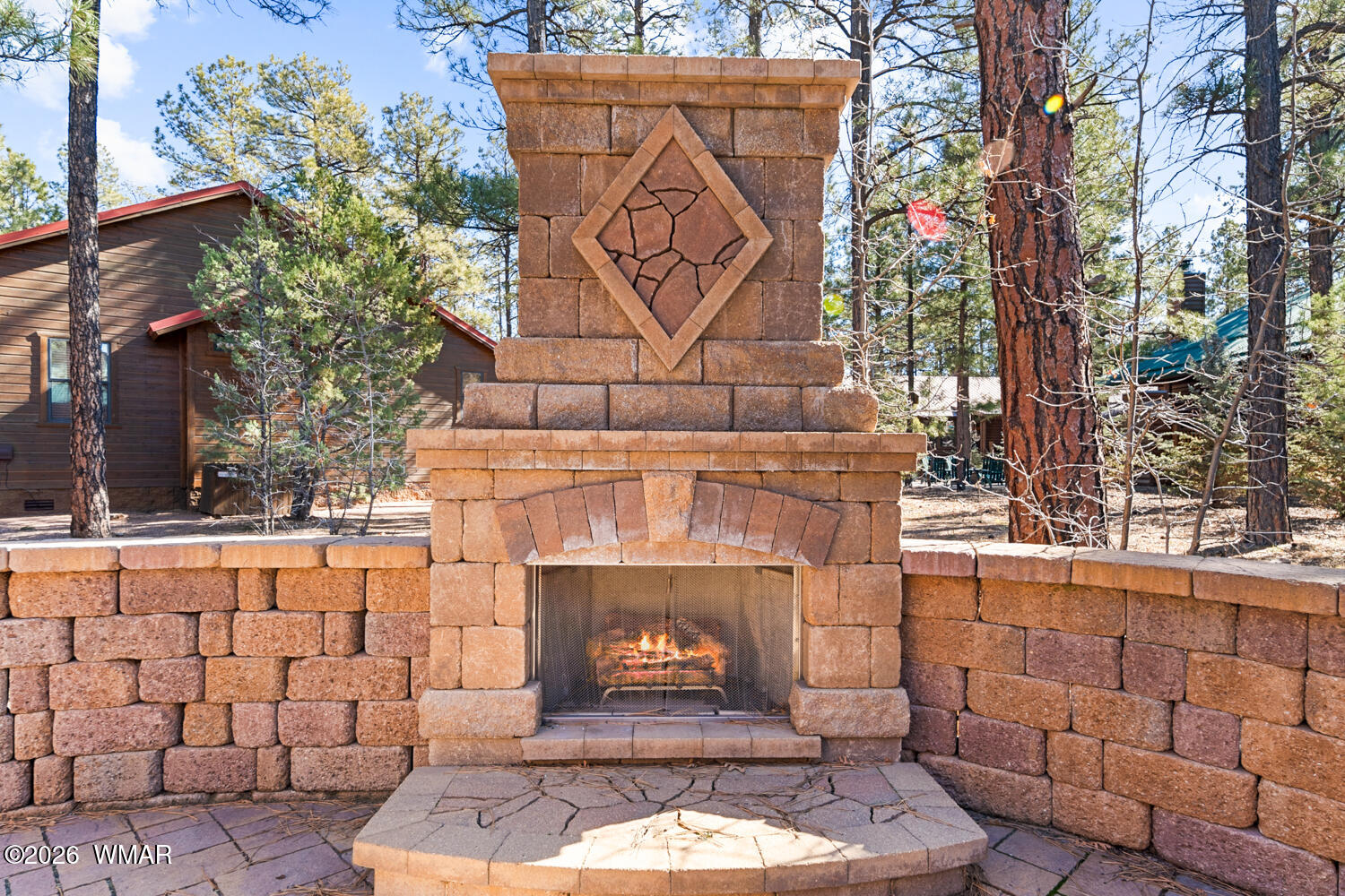1041 South Pinon Circle Show Low, AZ 85901 - Photo 24 of 29 a stone building with a bench in front of it