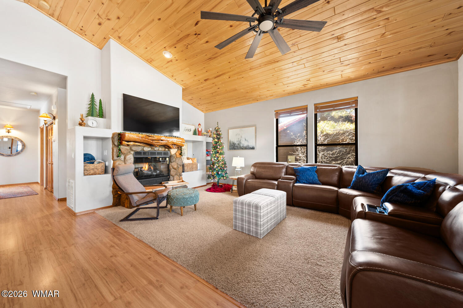 1041 South Pinon Circle Show Low, AZ 85901 - Photo 6 of 29 a living room with furniture a flat screen tv and a window