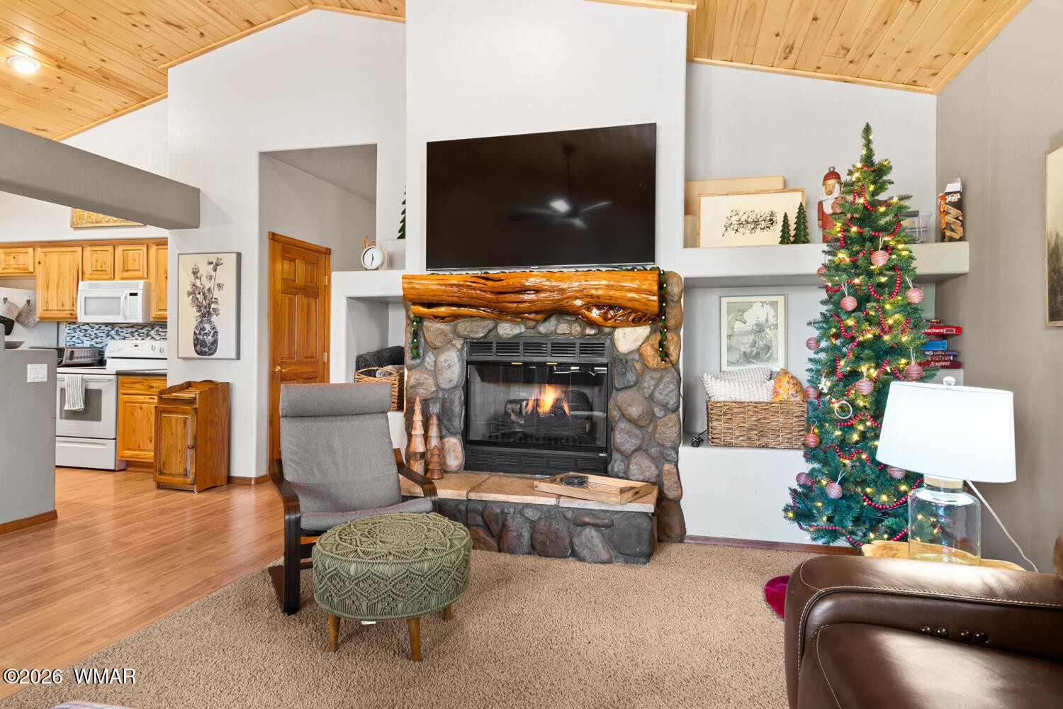 1041 South Pinon Circle Show Low, AZ 85901 - Photo 7 of 29 a living room with furniture a flat screen tv and a fireplace