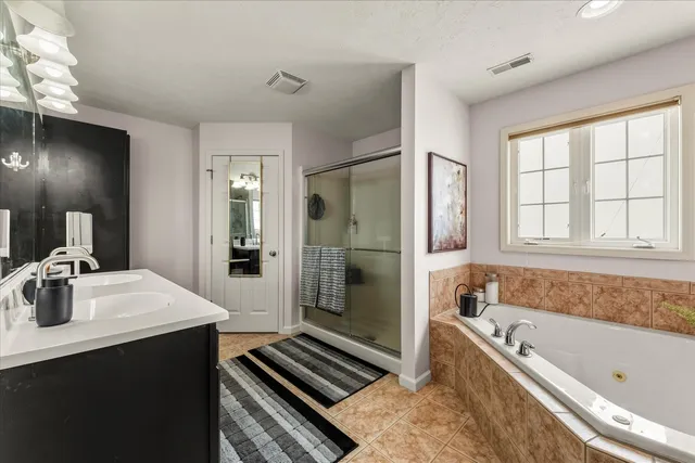 a bathroom with a sink vanity and a mirror