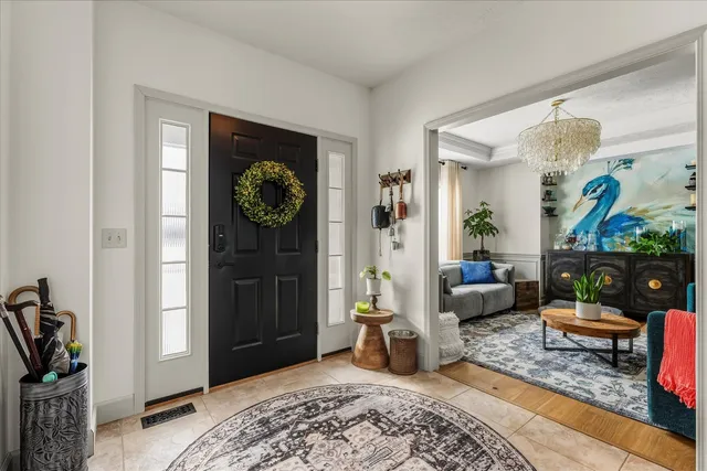 a bedroom with furniture and a rug