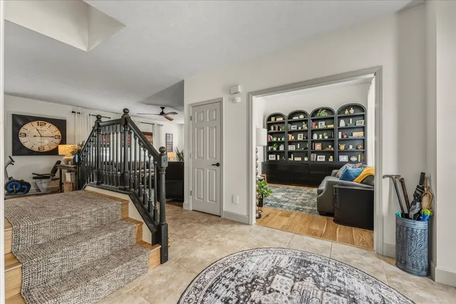 a living room with furniture a chandelier and a chandelier
