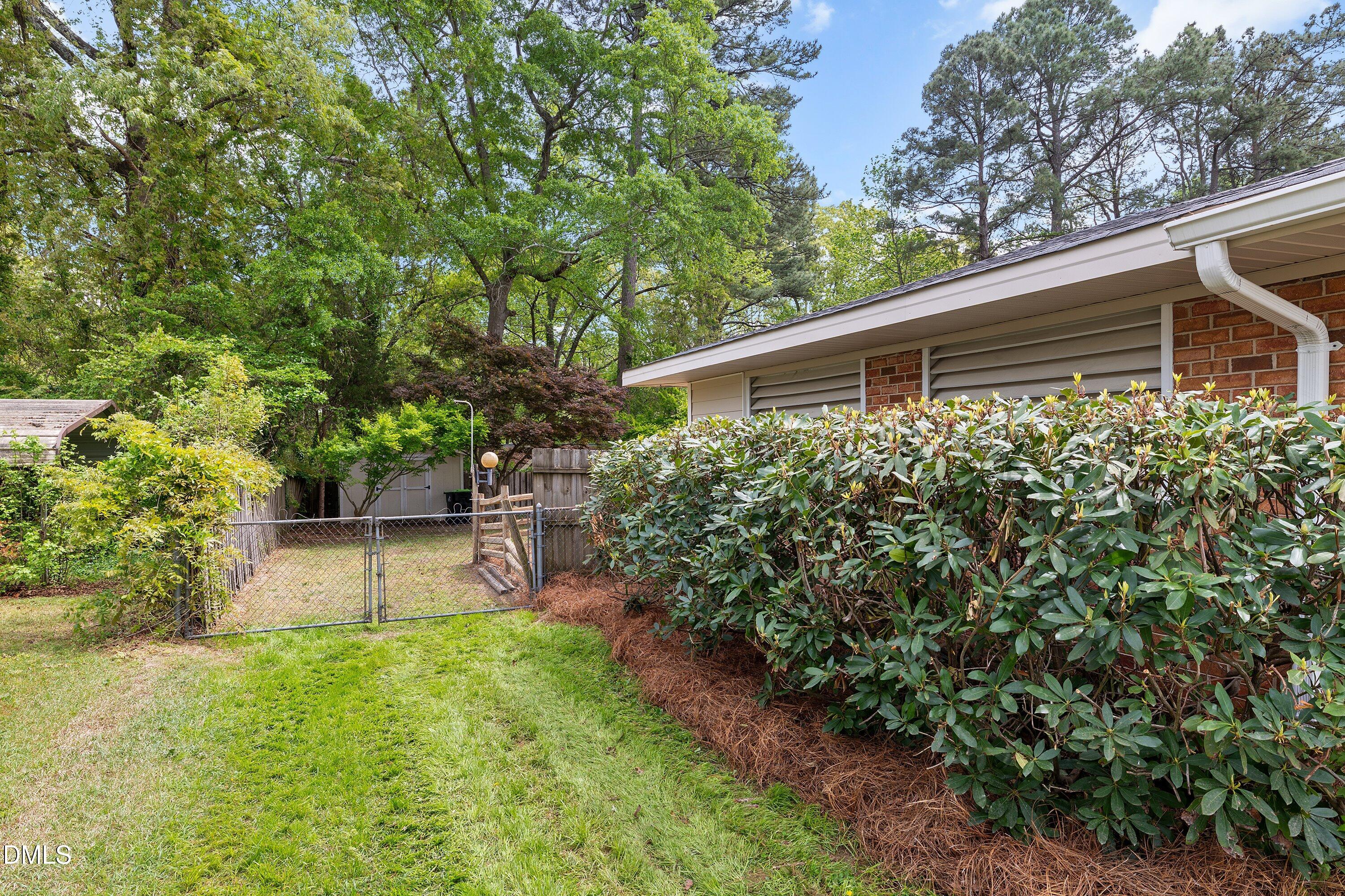 8413 Fayetteville Road Raleigh, NC 27603 - Photo 29 of 43 backyard-partially fenced