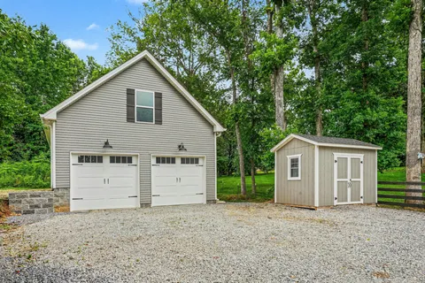 a front view of a house with a garage