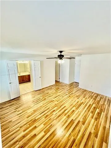 a view of a room with wooden floor
