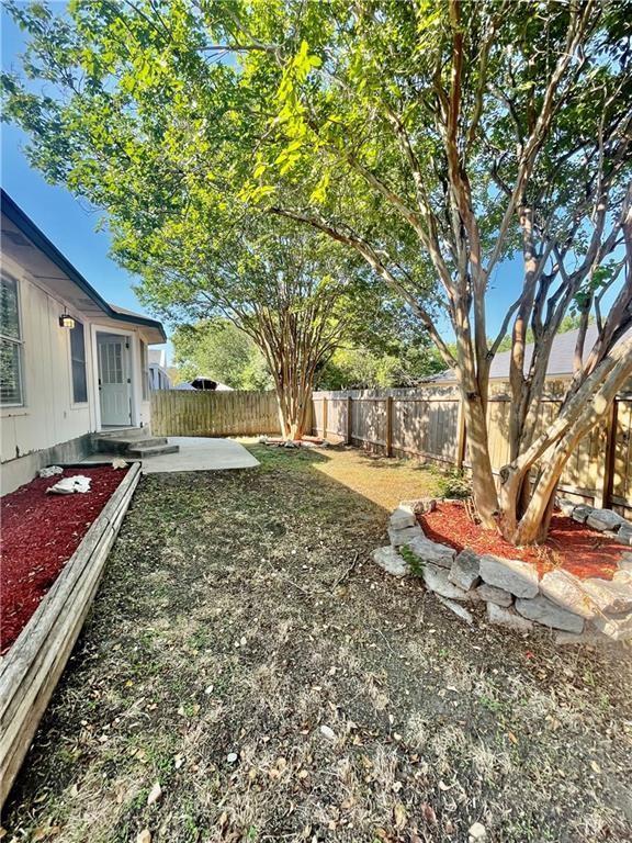 17312 Manish Drive Pflugerville, TX 78660 - Photo 16 of 19 a front view of a house with a yard