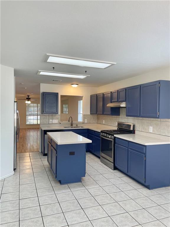 17312 Manish Drive Pflugerville, TX 78660 - Photo 4 of 19 a large kitchen with stainless steel appliances granite countertop a stove and a sink
