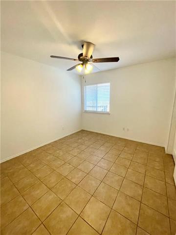 17312 Manish Drive Pflugerville, TX 78660 - Photo 7 of 19 a view of a room with a chandelier fan and windows