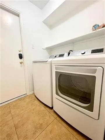 a utility room with washer and dryer