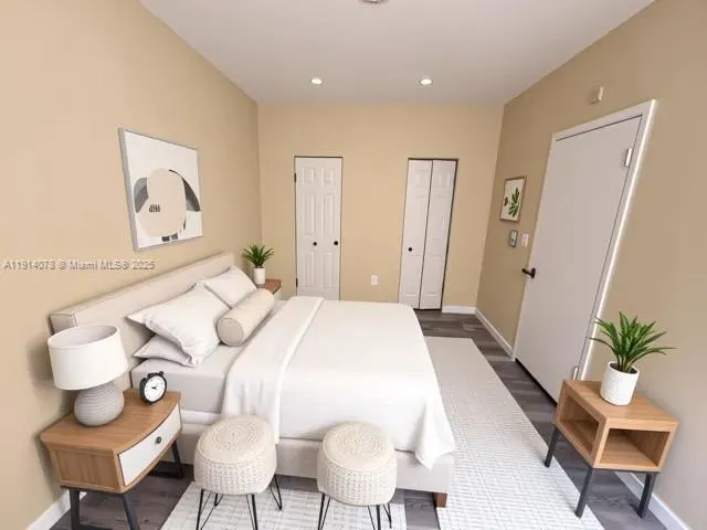 a bedroom with a bed and bathroom