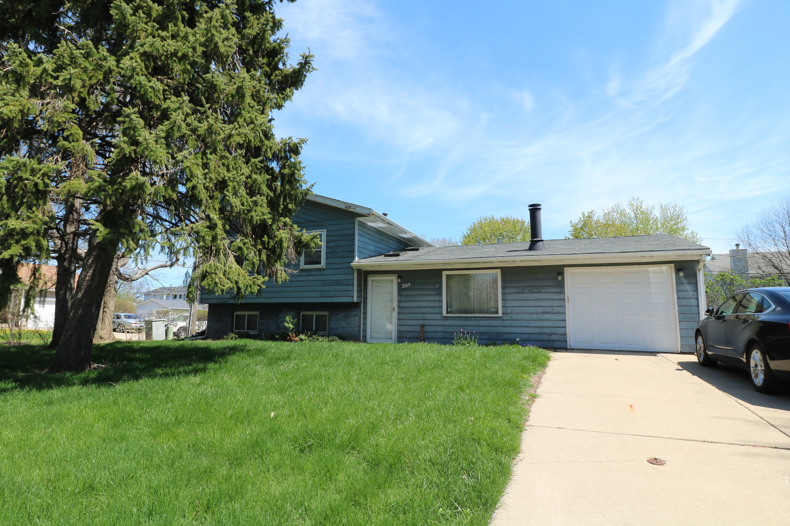 589 Redwood Road Bolingbrook, IL 60440 - Photo 1 of 18 a front view of house with yard