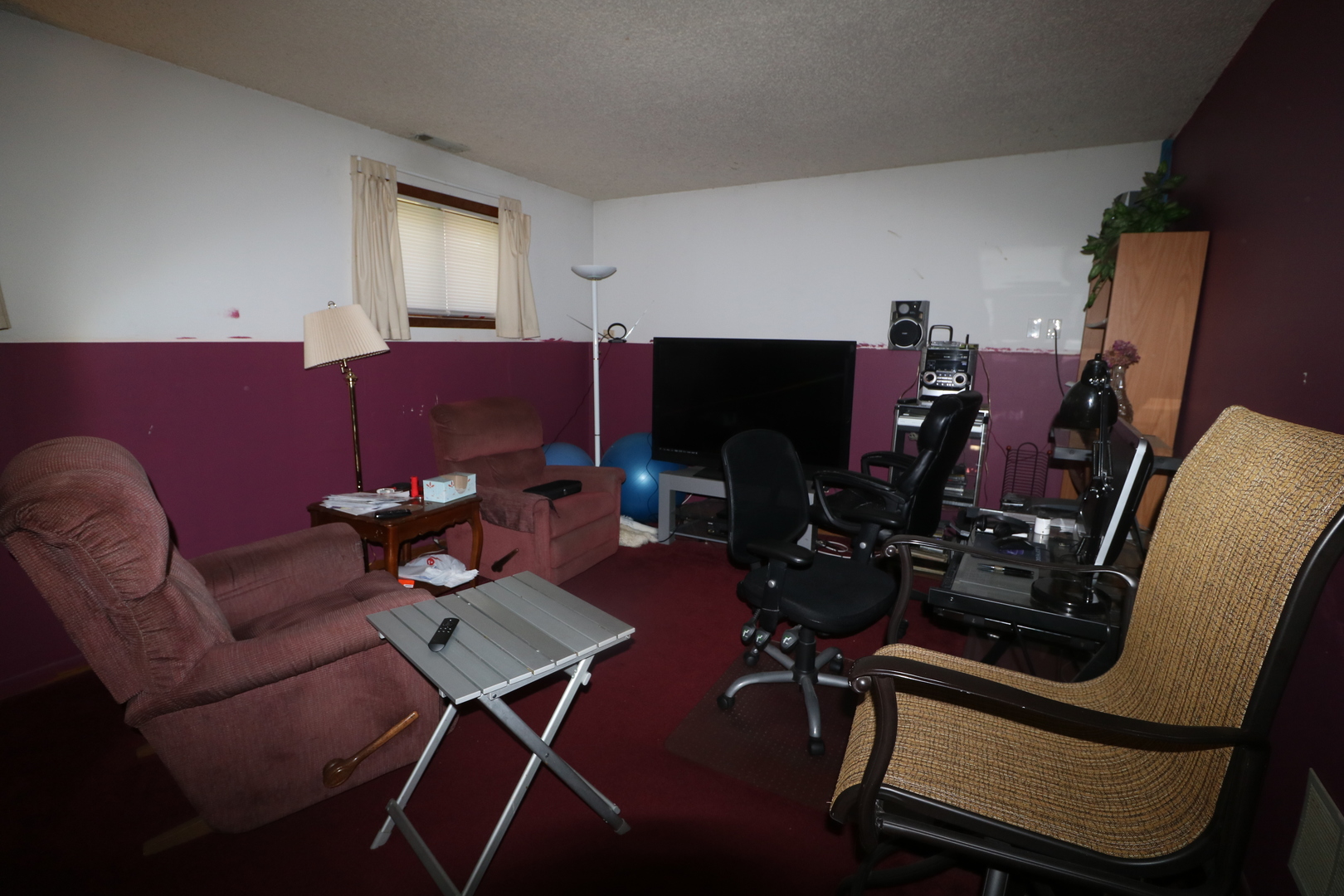589 Redwood Road Bolingbrook, IL 60440 - Photo 11 of 18 a living room with furniture and a flat screen tv