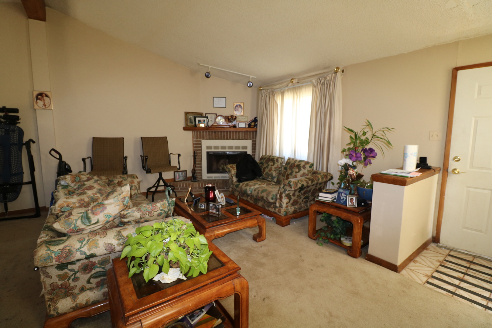 589 Redwood Road Bolingbrook, IL 60440 - Photo 15 of 18 a living room with furniture a window and a fireplace