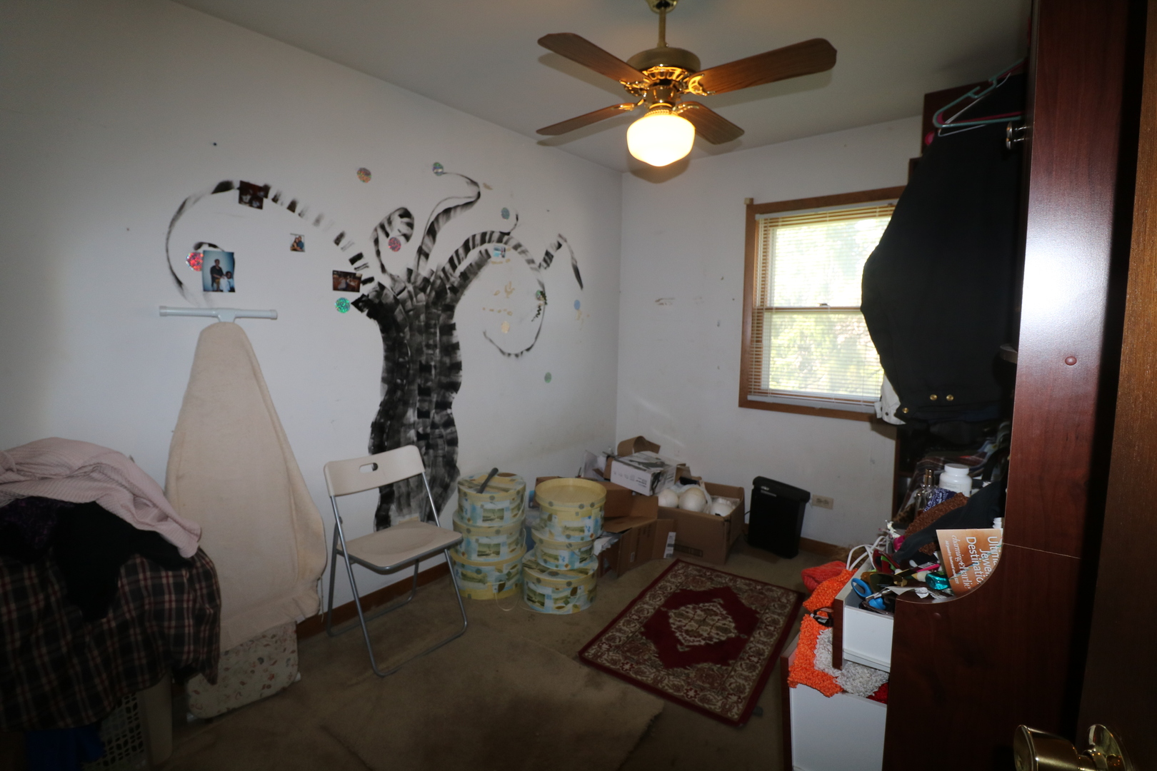 589 Redwood Road Bolingbrook, IL 60440 - Photo 9 of 18 a view of a workspace with furniture and a window