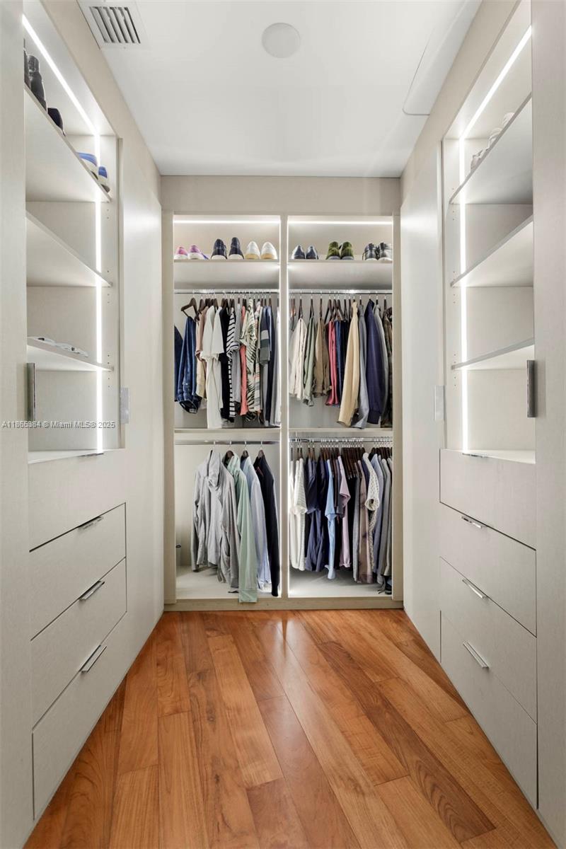 1300 Monad Terrace, Unit 11C Miami Beach, FL 33139 - Photo 11 of 29 a view of walk in closet with clothes and shoes