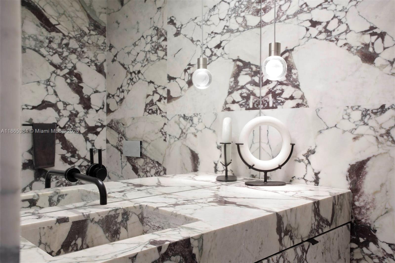 1300 Monad Terrace, Unit 11C Miami Beach, FL 33139 - Photo 13 of 29 a bathroom with a sink and a mirror