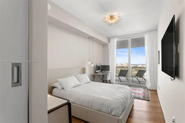 a bathroom with a shower sink and mirror