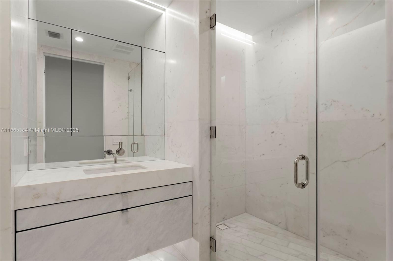 1300 Monad Terrace, Unit 11C Miami Beach, FL 33139 - Photo 16 of 29 a bathroom with a shower sink and mirror