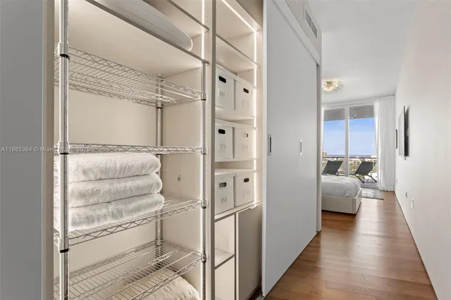 a balcony with wooden floor and city view