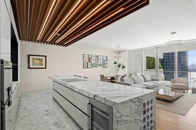 a living room with granite countertop furniture and fireplace