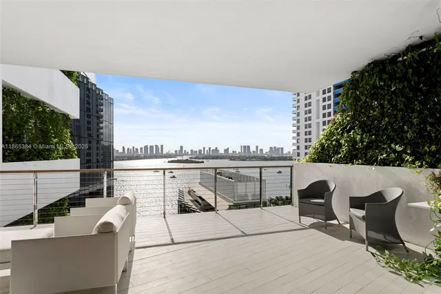 a terrace with outdoor seating and city view