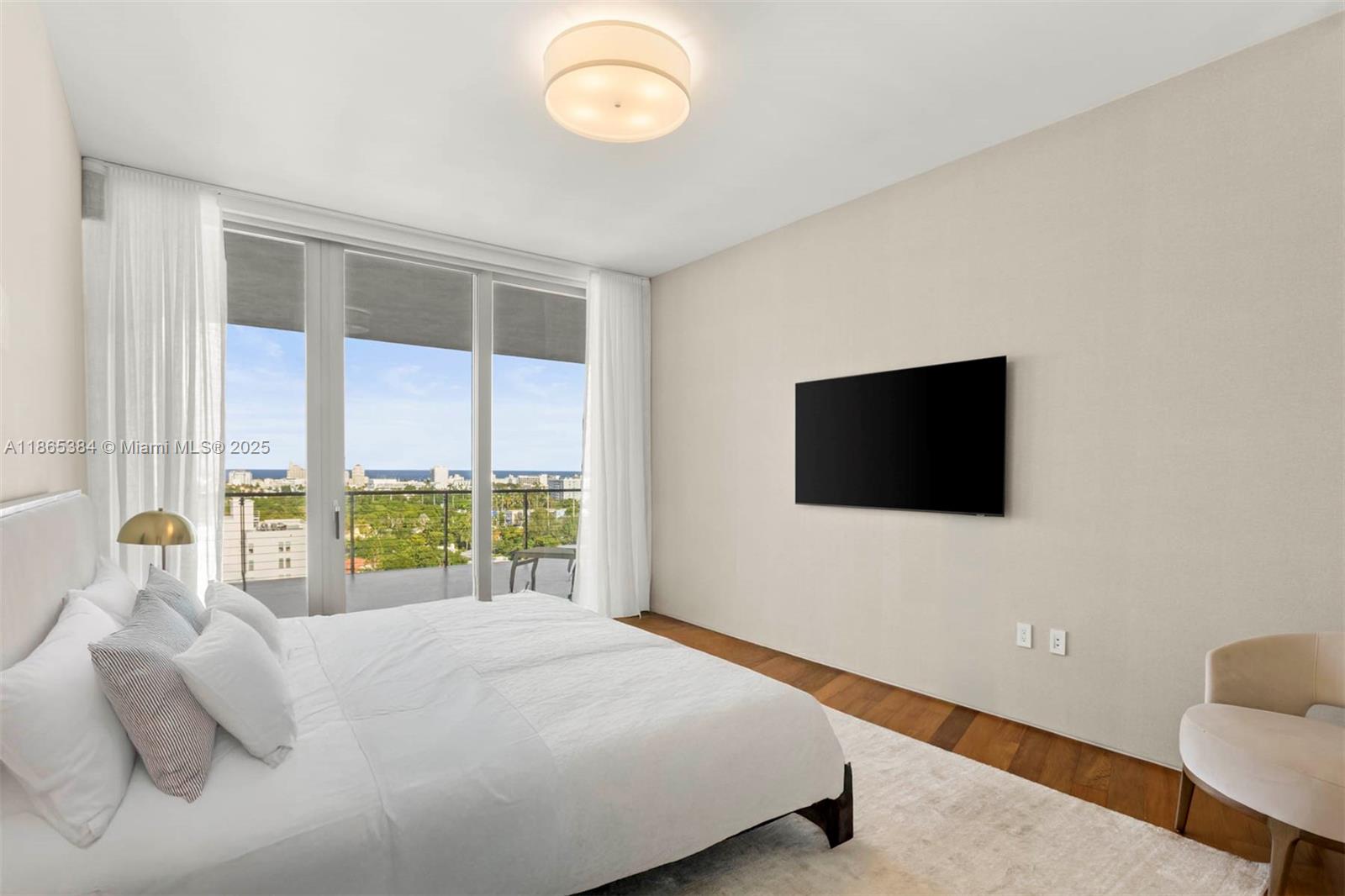 1300 Monad Terrace, Unit 11C Miami Beach, FL 33139 - Photo 6 of 29 a bedroom with a bed and a flat screen tv