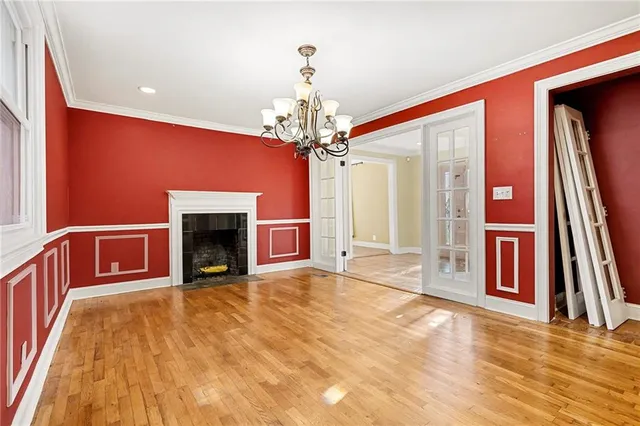 a view of an empty room with a fireplace