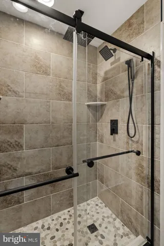 a view of an entryway with wooden floor