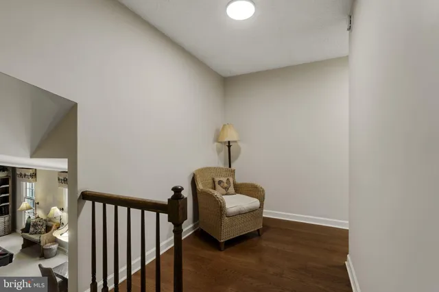 an empty room with a window and a ceiling fan