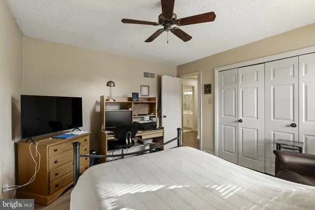 a bathroom with a sink and mirror with toilet