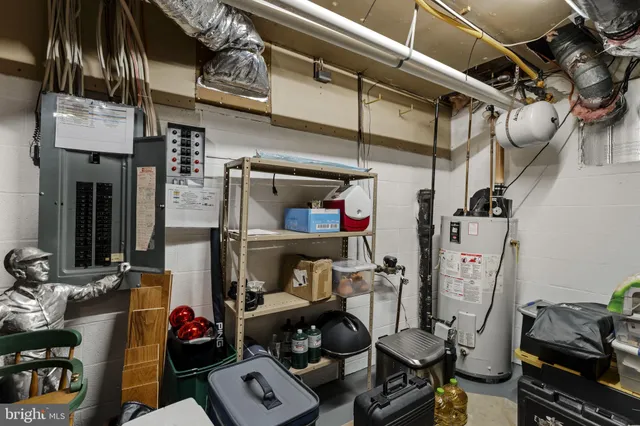 a wooden bench sitting in front of a building