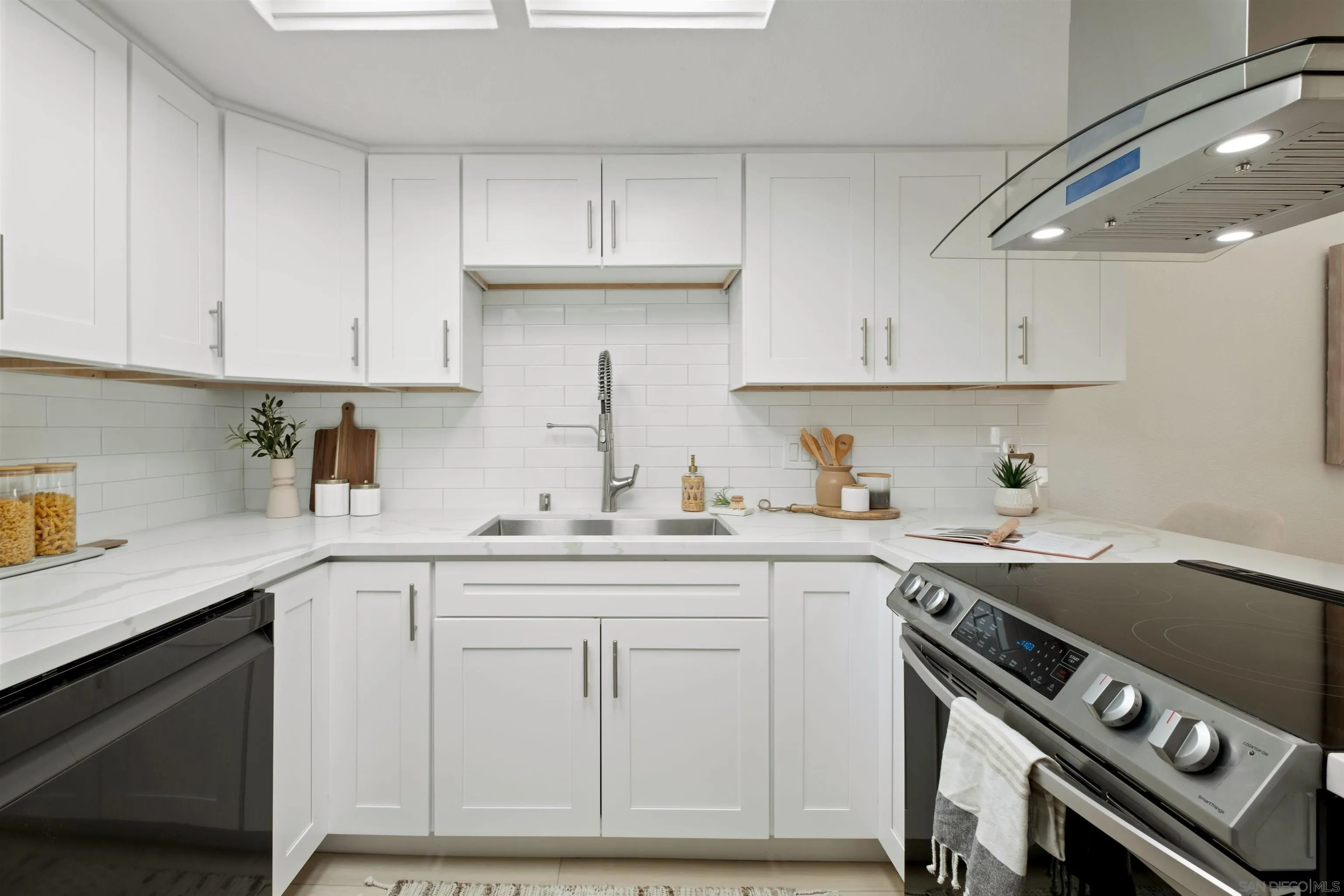 300 Roanoke Road, Unit 11 El Cajon, CA 92020 - Photo 11 of 28 a kitchen with a sink stainless steel appliances and cabinets
