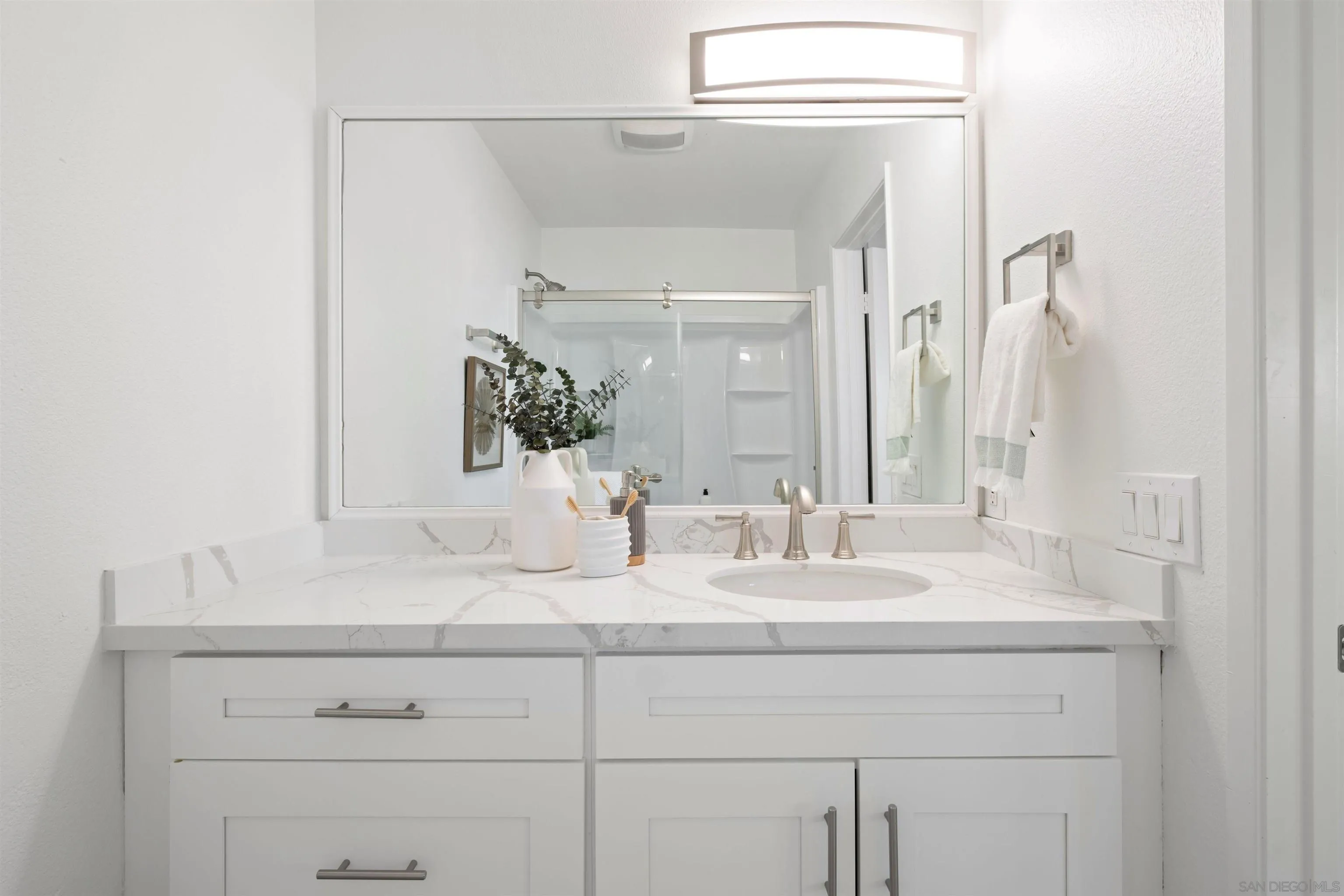 300 Roanoke Road, Unit 11 El Cajon, CA 92020 - Photo 17 of 28 a bathroom with a sink and a mirror