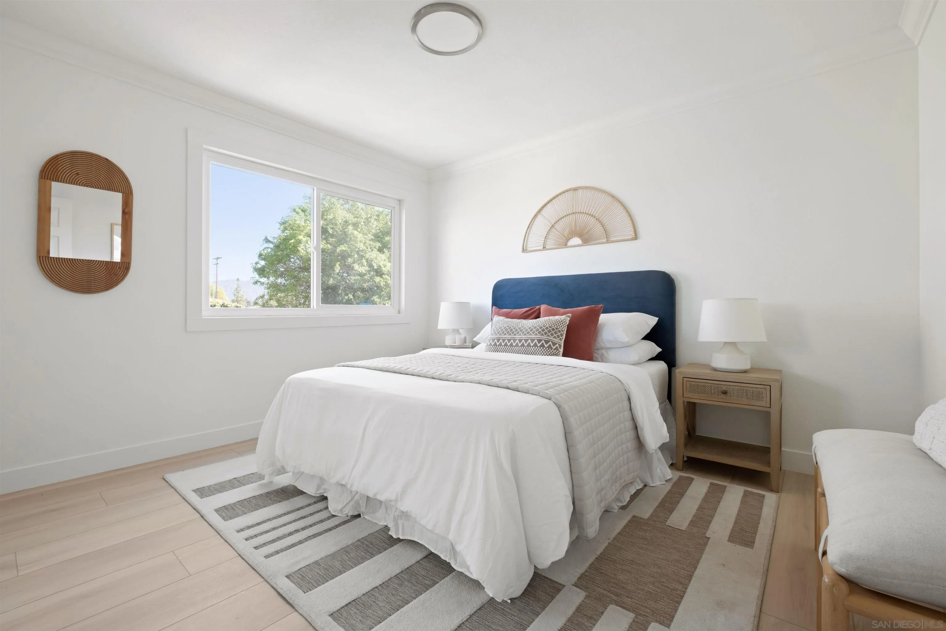 300 Roanoke Road, Unit 11 El Cajon, CA 92020 - Photo 19 of 28 a bedroom with a bed and a window