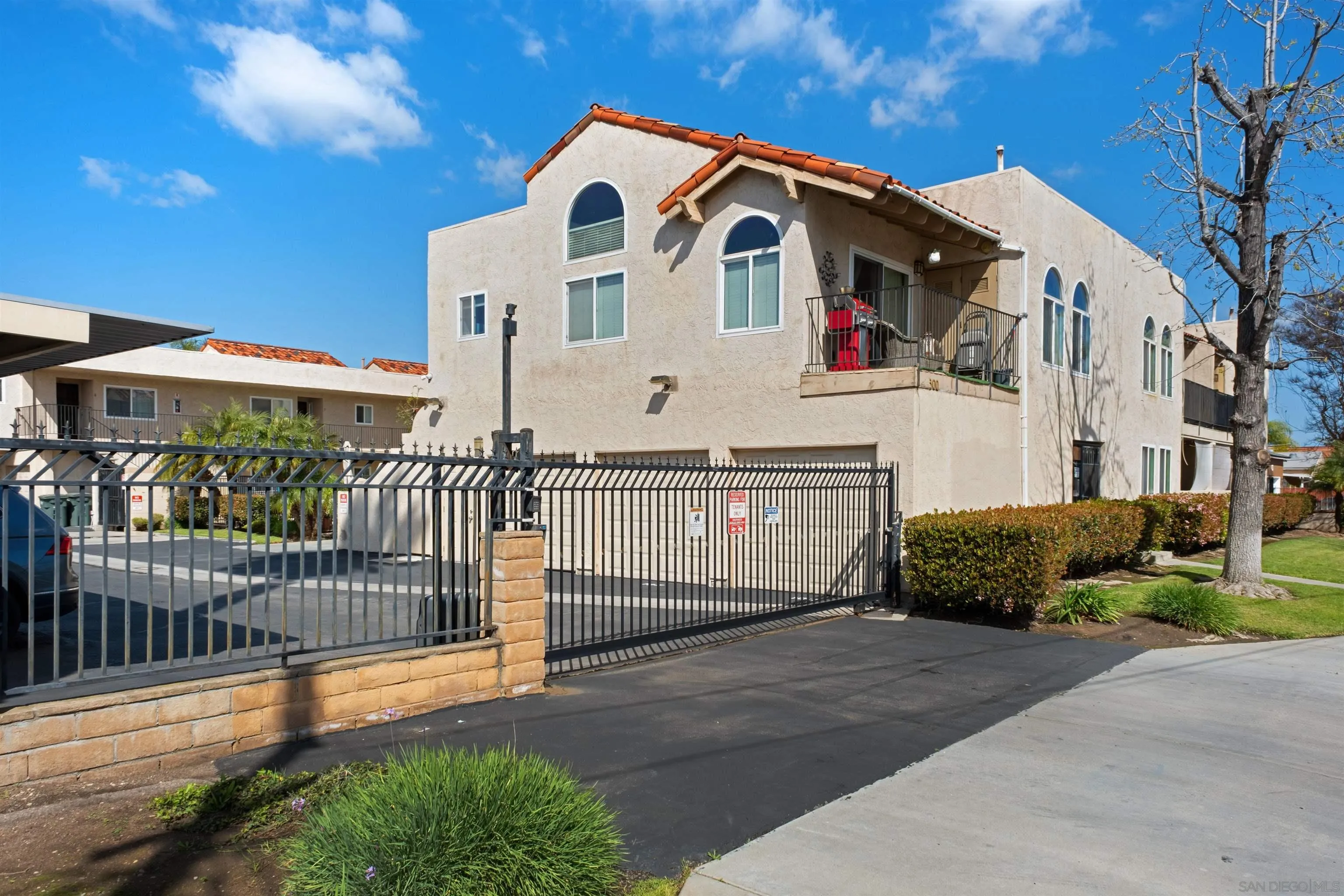 300 Roanoke Road, Unit 11 El Cajon, CA 92020 - Photo 23 of 28 a front view of a house with wooden fence