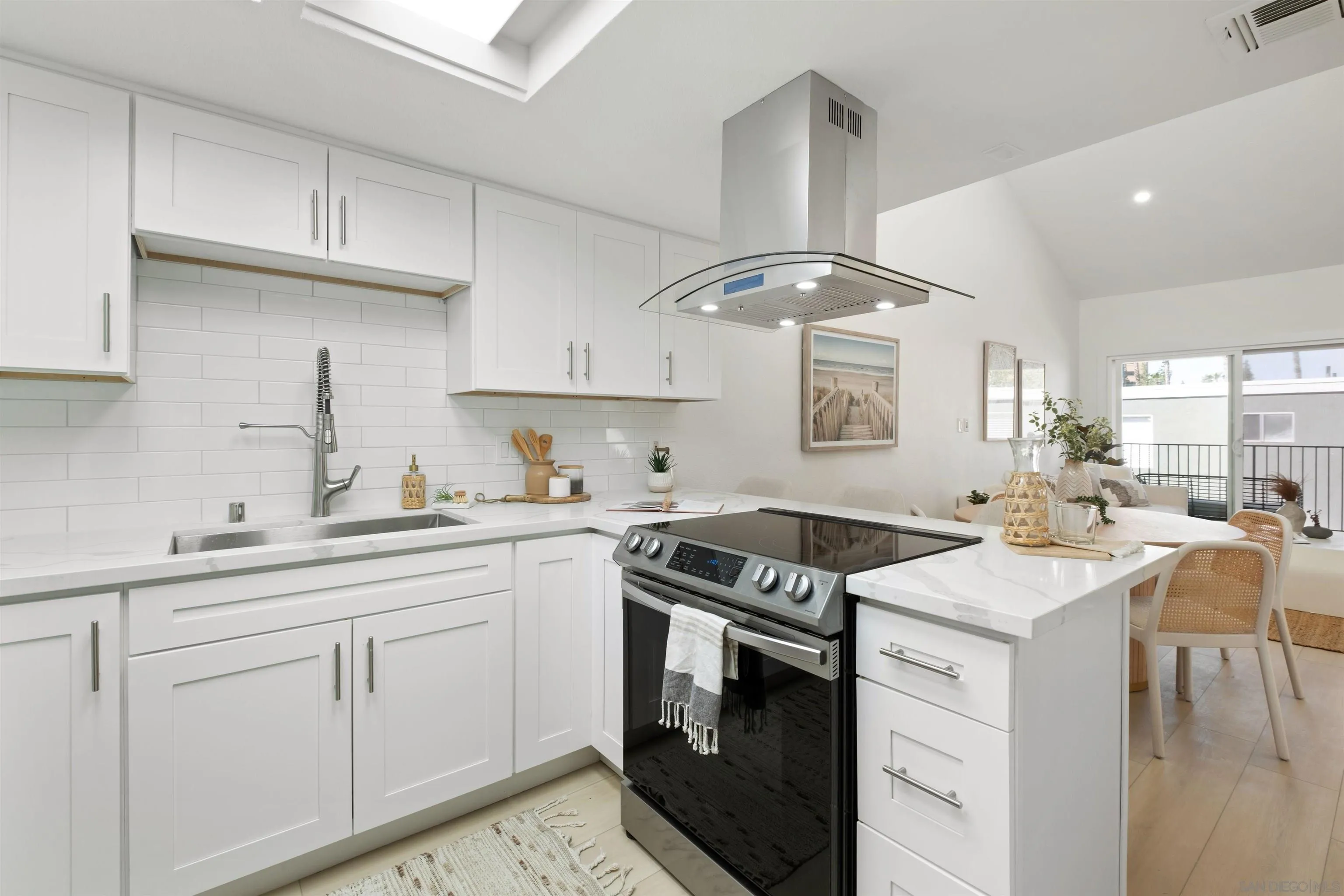 300 Roanoke Road, Unit 11 El Cajon, CA 92020 - Photo 10 of 28 a kitchen with a sink stove and cabinets