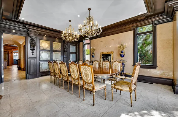 a kitchen with stainless steel appliances granite countertop a stove a sink and a wooden cabinets