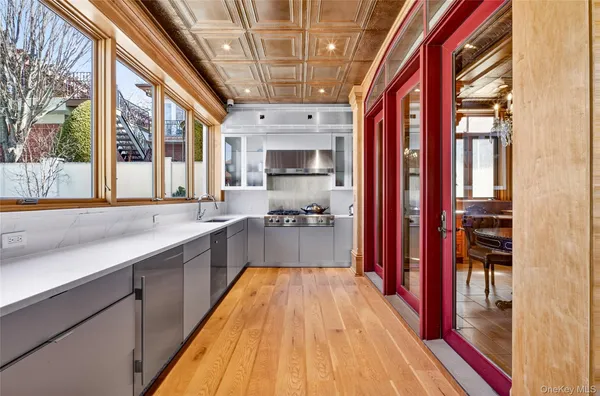 a view of a bathroom with a tub and a large window