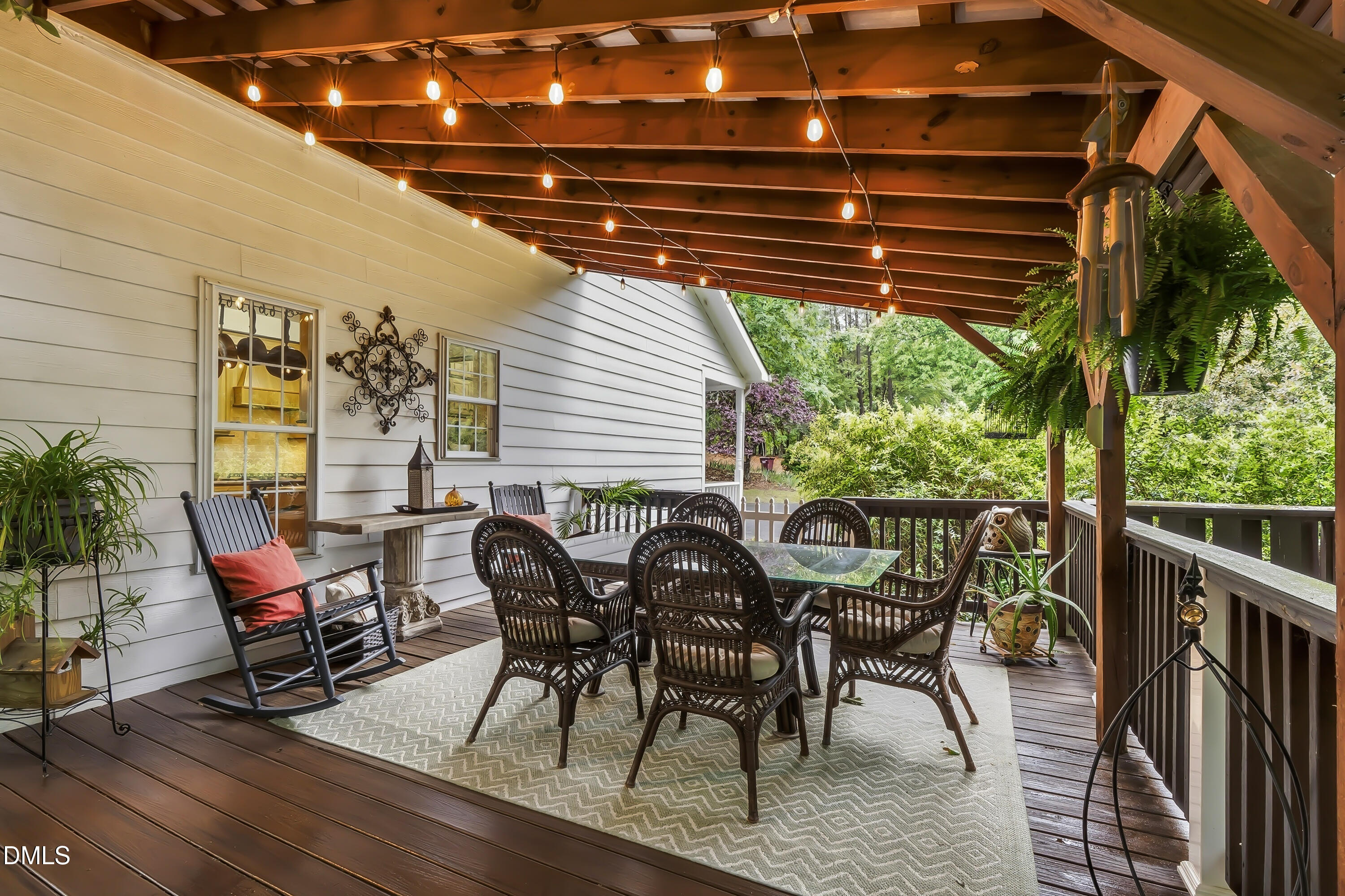 1214 Halcyon Place Rougemont, NC 27572 - Photo 44 of 69 a view of a patio with table and chairs with wooden floor and fence