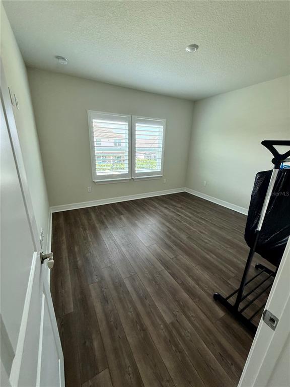 8441 Pk Clf Way Orlando, FL 32836 - Photo 25 of 59 wooden floor in an empty room with a window