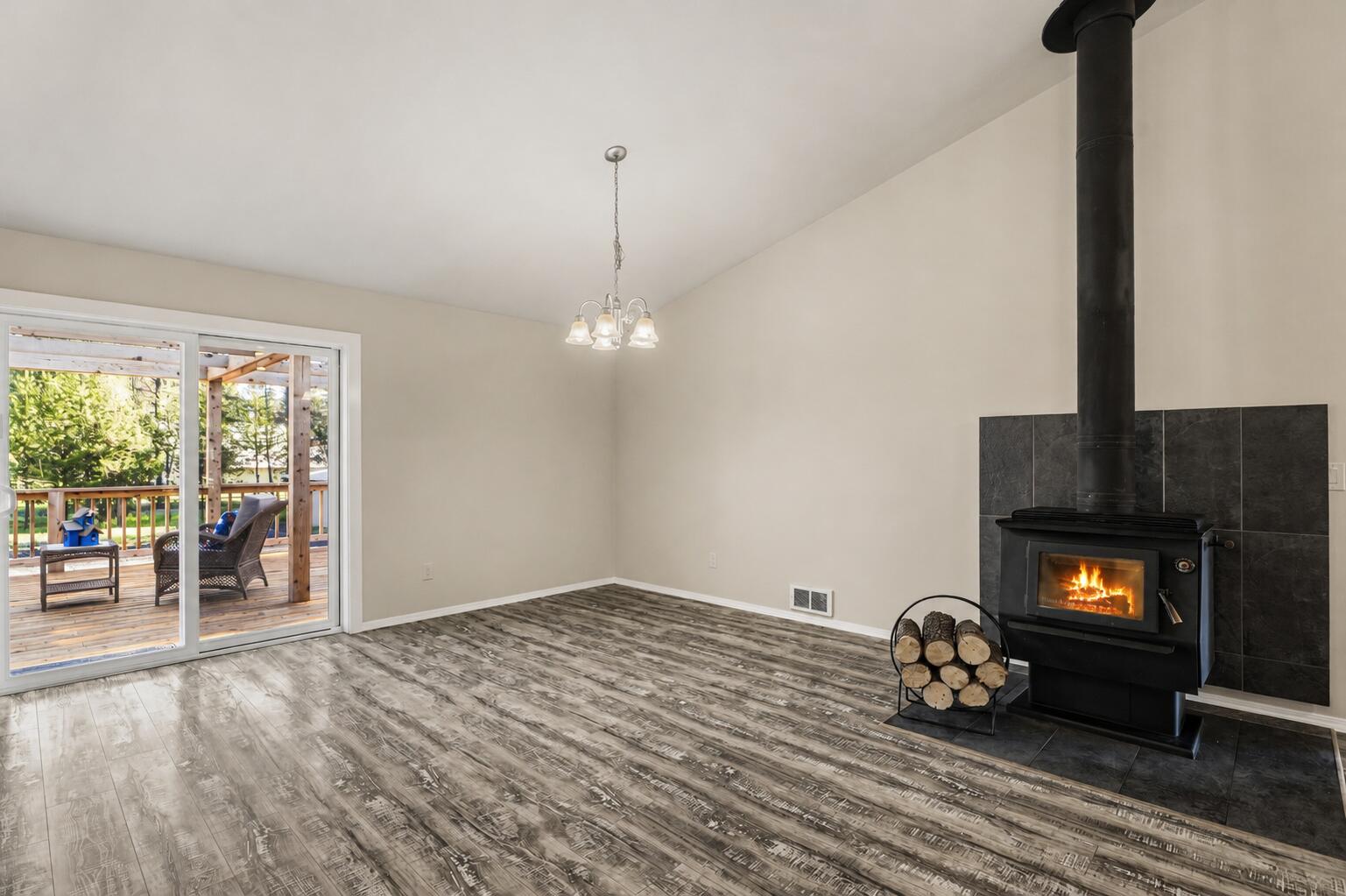 16050 Dick Road La Pine, OR 97739 - Photo 11 of 59 a view of an empty room with a fireplace