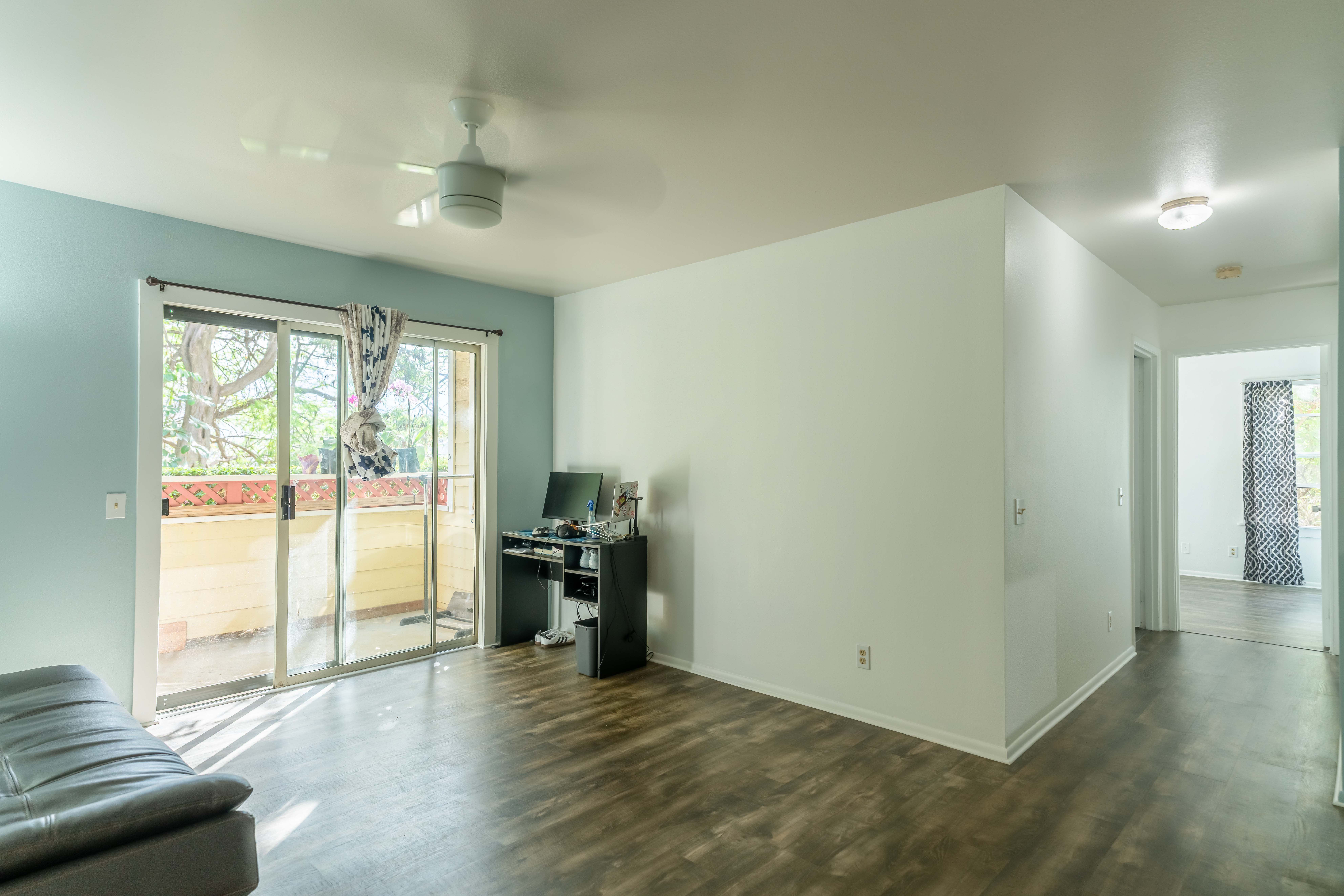 68-3831 Lua Kula Street, Unit L107 Waikoloa, HI 96738 - Photo 1 of 17 a view of livingroom with furniture and floor to ceiling window