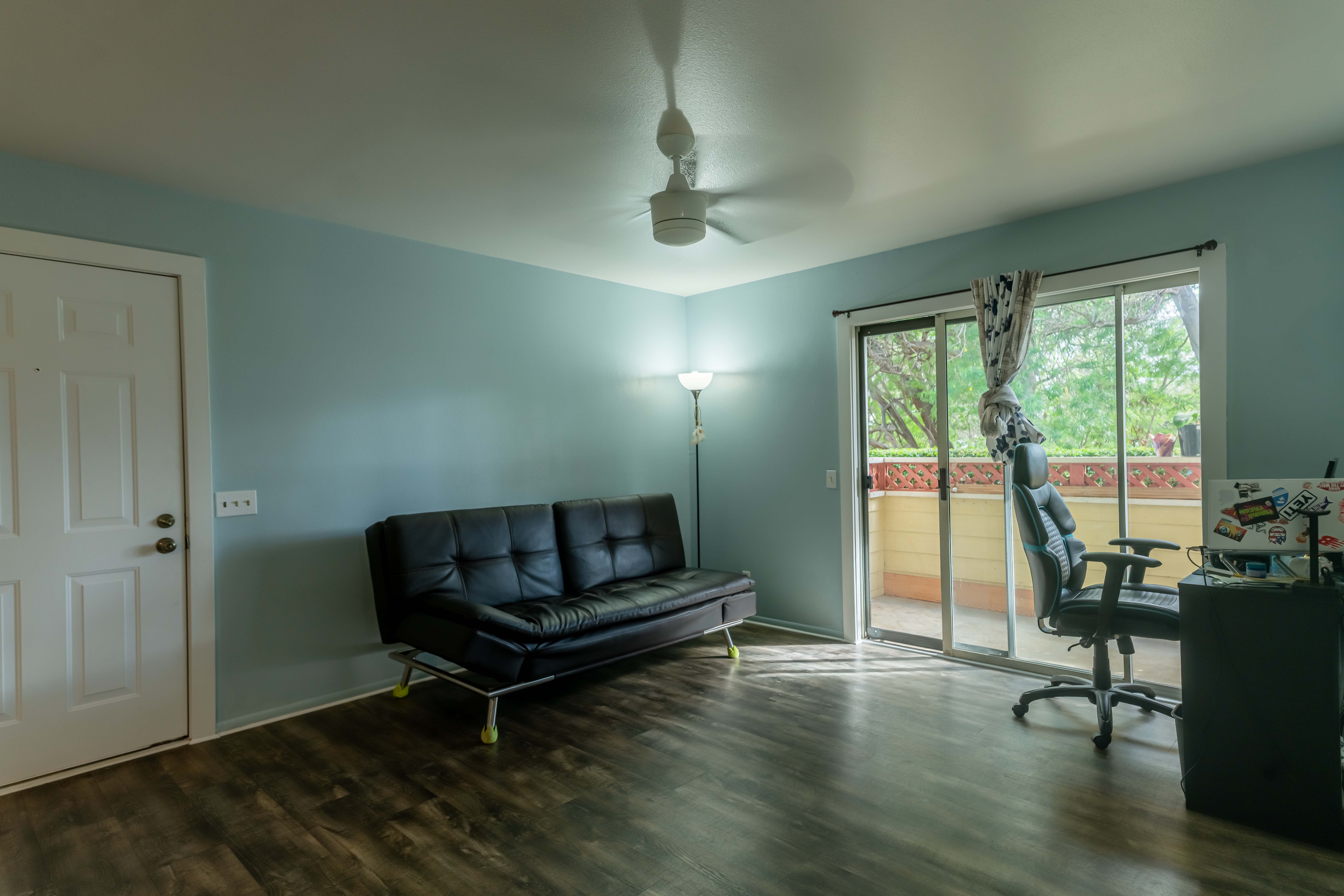 68-3831 Lua Kula Street, Unit L107 Waikoloa, HI 96738 - Photo 2 of 17 a living room with furniture and a large window