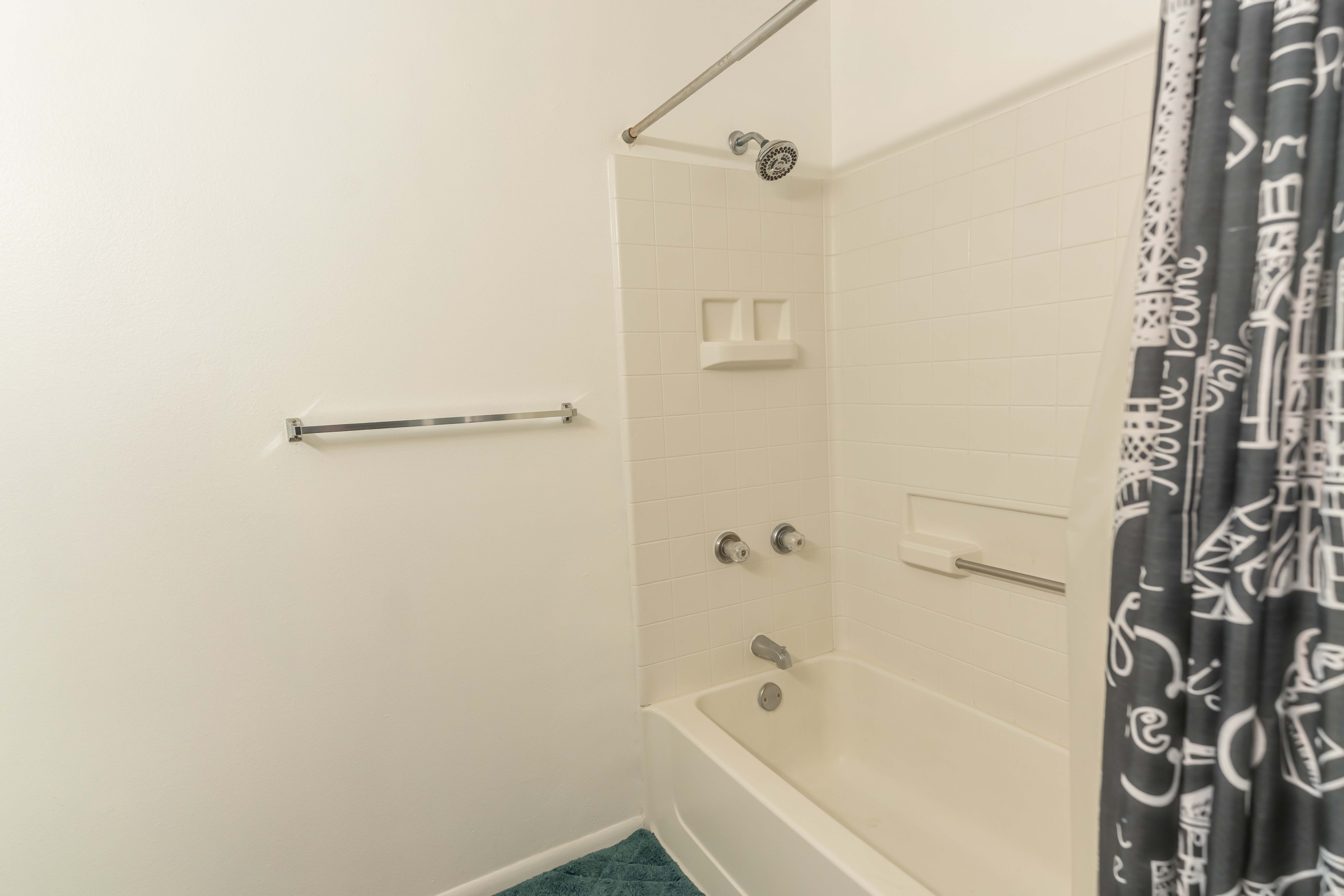 68-3831 Lua Kula Street, Unit L107 Waikoloa, HI 96738 - Photo 9 of 17 a bathroom with a bathtub and shower