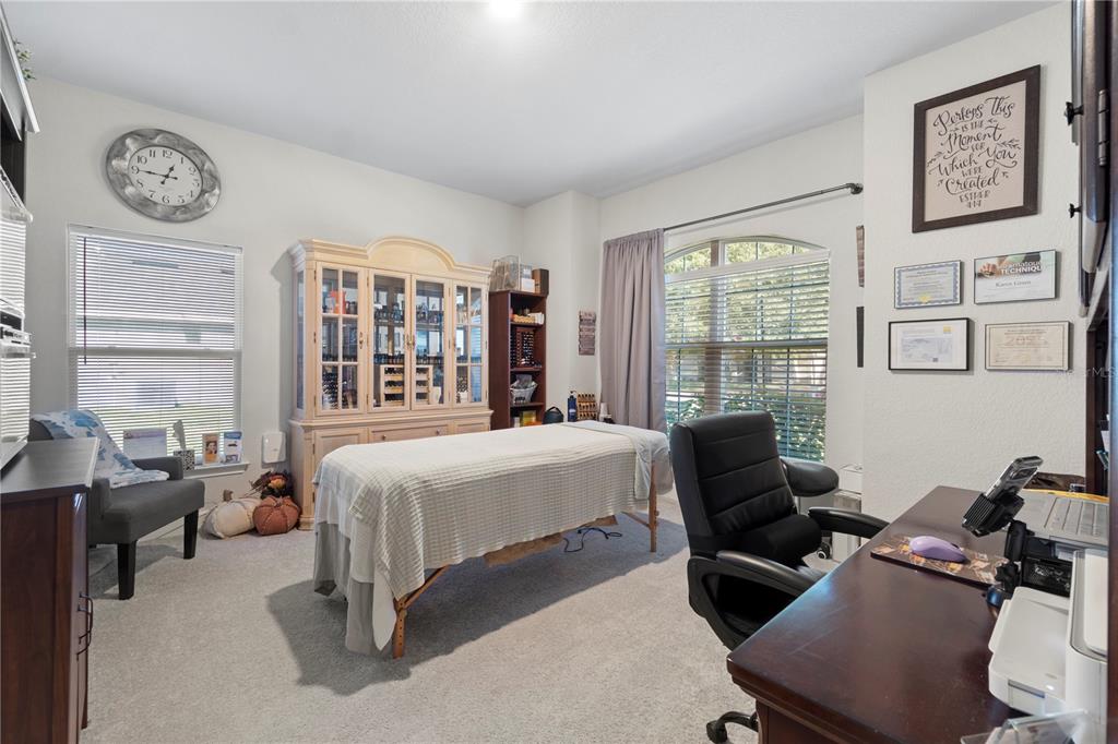 10170 Southwest 78th Court Ocala, FL 34476 - Photo 13 of 43 a bedroom with a bed and a large window