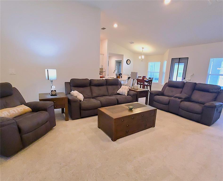 10170 Southwest 78th Court Ocala, FL 34476 - Photo 18 of 44 a living room with furniture and a couch